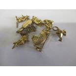 A quantity of 9ct gold charms, approximate weight 15g