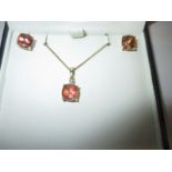A 9ct gold necklace and earrings set, set with mystic topaz