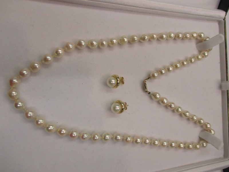 A Baroque pearl necklace with gold clasp and a pair of gold & pearl earrings