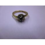 An 18ct gold diamond and sapphire ring