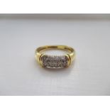 An 18ct gold ring set with 3 rows of pavé-set brilliant cut diamonds