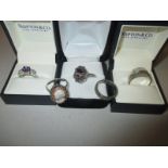 Five silver dress rings