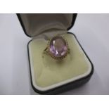 A 1950s 9ct gold ring set with a single amethyst