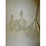 Three Victorian hand blown glass bottles and a large glass funnel