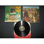 The Beatles Sgt Pepper's Lonely Hearts Club Band 12 inch vinyl record in pristine condition with