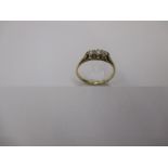 A gold and 3 stone diamond ring