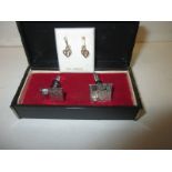 A pair of 9ct white gold cufflinks each set with a stud diamond and a piar of 9ct gold earrings