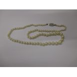 A baroque pearl necklace with 9ct white gold clasp