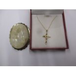 A 9ct gold necklace with pendant cross, and a silver mounted cameo brooch