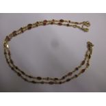 A 22ct gold necklace set with rubies