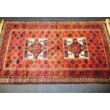 An Afghan Turkman hand knotted wool rug, approx size 110 x 200cm