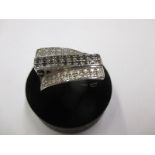 A 9ct white gold ring set with a central band of black diamonds and outer bands with white diamonds