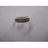 A 9ct gold and 7 stone diamond ring