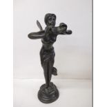 A cast metal figure of a winged goddess