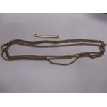 A yellow metal 3 strand necklace and a 9ct gold tie clip