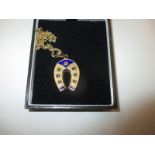 A high carat gold enamelled necklace pendant with 9ct gold chain