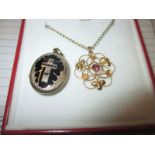 A late 19th early 20th century gold necklace pendant and a mourning locket