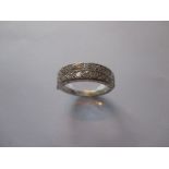 An 18ct white gold half eternity ring set with diamonds