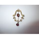 An Edwardian pendant set with seed pearls and rubies