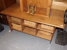A Pine Coffee Table With Storage Baskets Under