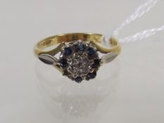 A 9ct Illusion Set Diamond Ring With Sapphires, La