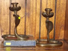 A Pair Of Brass Cobra Candlesticks & A Box Of Plat