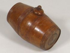 A Carved Walnut Brandy Barrel