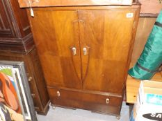 An Art Deco Style Tallboy With Drawer