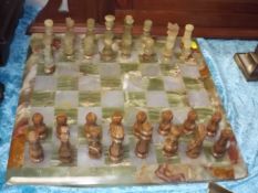 An Onyx Chess Board With Pieces