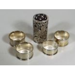 A Pair Of Silver Napkin Rings, Two Other Silver Na