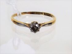An 18ct Gold Ring With Small Diamond