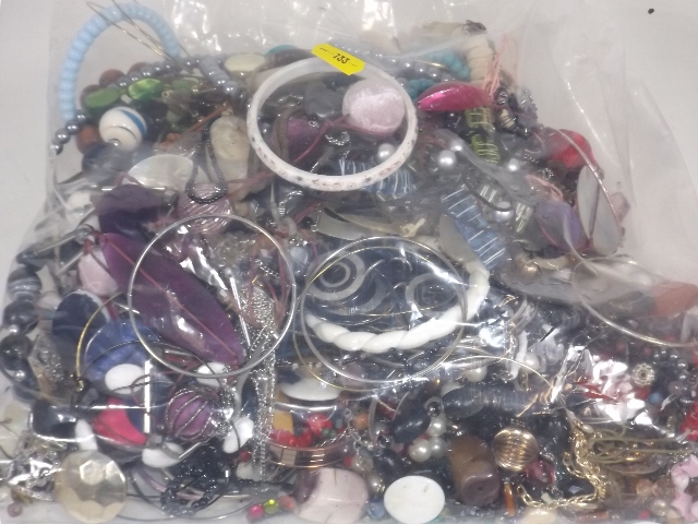 A Large Mixed Bag Of Costume Jewellery On Behalf O