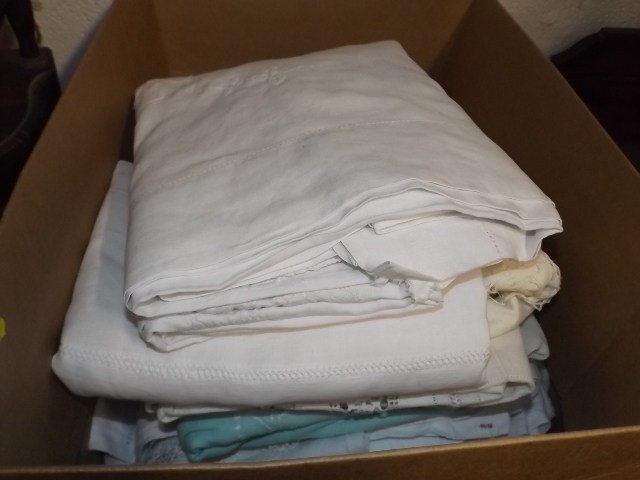 A Small Box Of Various Linen Items