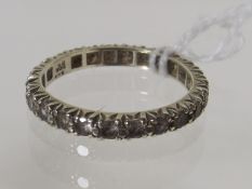 A White Eternity Metal Ring With White Stones