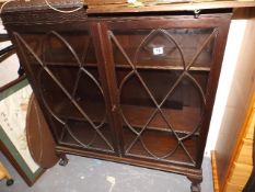 A Mahogany Glazed Display Cabinet With Lion Claw F