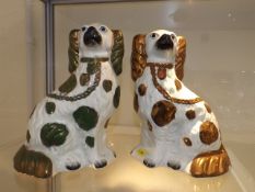A Pair Of Staffordshire Dog Figures