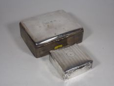 A Silver Cigar Box Twinned With A Silver Cigarette