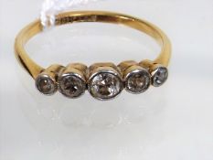 An 18ct Gold Ring With Five Small Diamonds