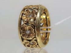 A Yellow Metal Ladies Ring Set With Diamonds