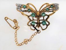 A Gold Butterfly Brooch With Diamonds & Blue Green