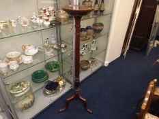 A Mahogany Torchere With Fluted Column
