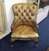 An Antique Button Back Leather Nursing Chair