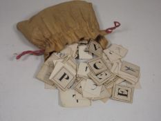 A Bagged Quantity Of Early 19thC. Spelling Game Le