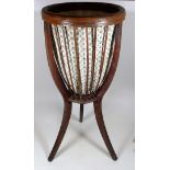 An Edwardian Mahogany Jardiniere Stand