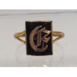 A 9ct Gold Ring With Gold Initial In Jet Stone