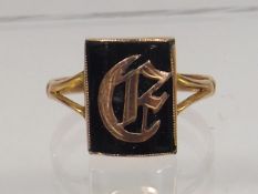 A 9ct Gold Ring With Gold Initial In Jet Stone