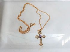 A Small Gold Crucifix With Amethyst & Chain