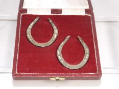A Pair Of Silver Horse Shoes
