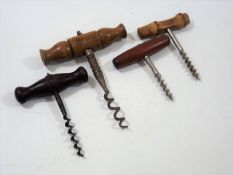 An Antique Corkscrew Twinned With Three Others