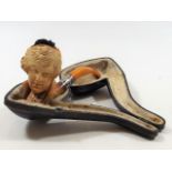 A Well Carved Cased Meerschaum Pipe Depicting Woma